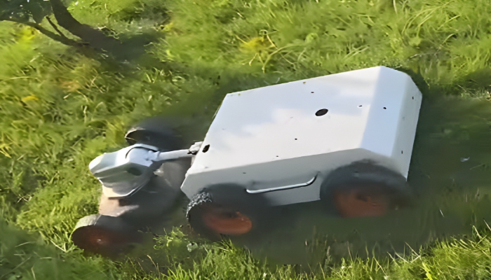 Wheeled robot mower working on grass field